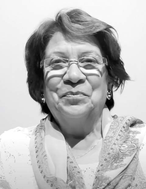 Aída Abella speaking at a political event in 2016